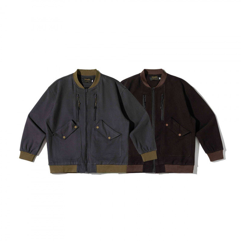 Unisex Oversize-Utilitarian Bomber Jacket with Flap Pockets, Vertical Zippers, and Ribbed Finishes Shop Velvia