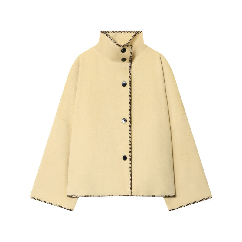 Women's short cape coat with stand collar, contrasting decorative stitch edge, and oversized sleeves Shop Velvia