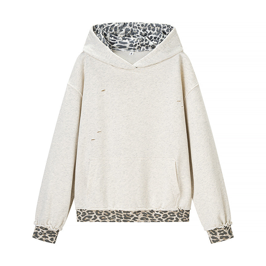 Women’s cropped oversized hoodie with leopard inner lining, used details and kangaroo pocket Shop Velvia