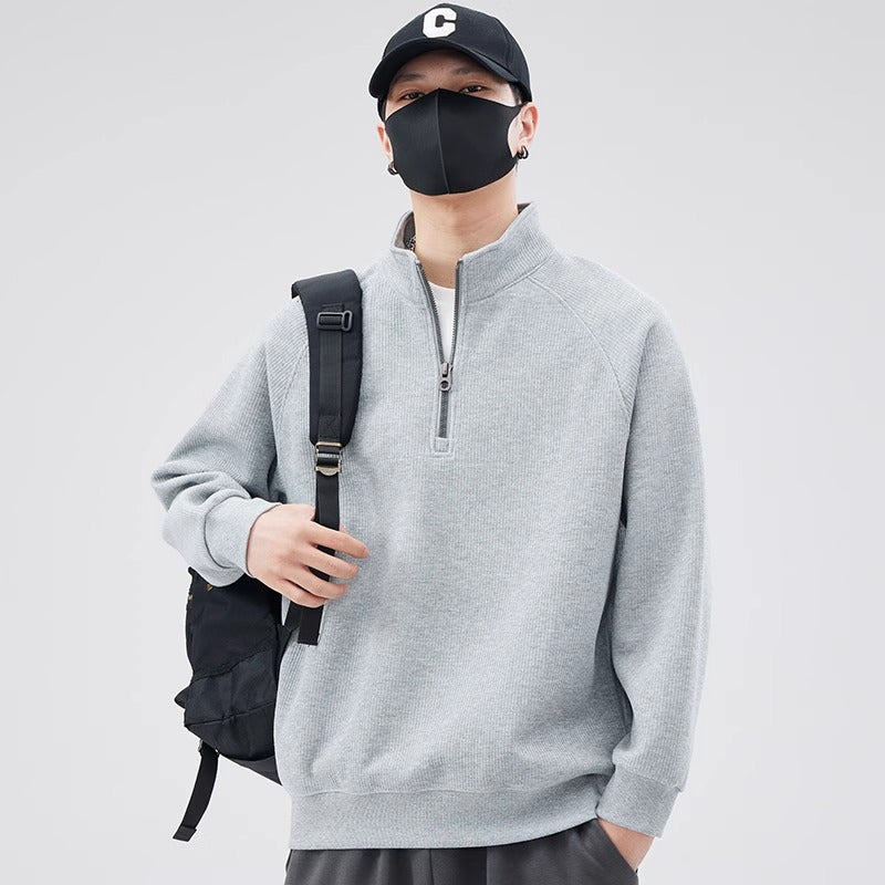 Loose pullover with stand-up collar and zipper