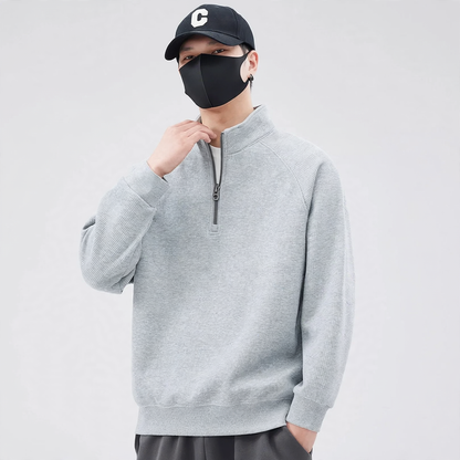 Loose pullover with stand-up collar and zipper