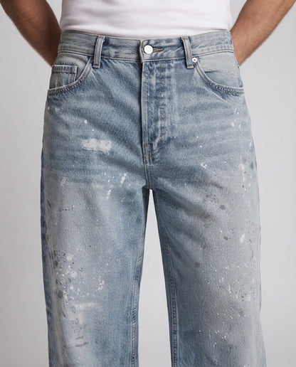 Men's loose-fitting vintage denim jeans with used effects and paint splatter Shop Velvia