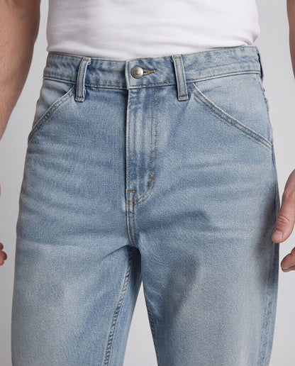 Men's wide tapered denim jeans with mid-rise waistband and contrasting outer seam details Shop Velvia