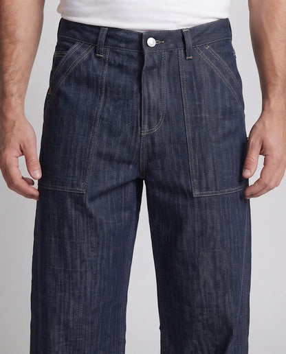 Men's denim palazzo pants in an ultra-wide baggy cut with visible decorative seams and patch front pockets Shop Velvia