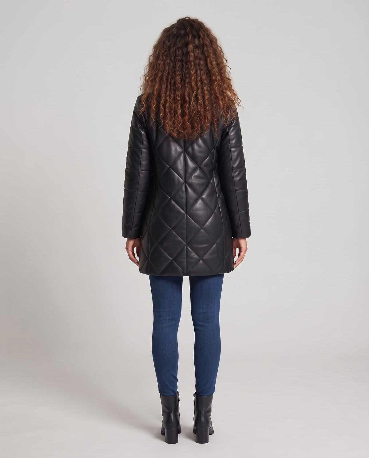 Women's padded coat made of faux leather with a tailored A-line and detachable faux fur collar Shop Velvia