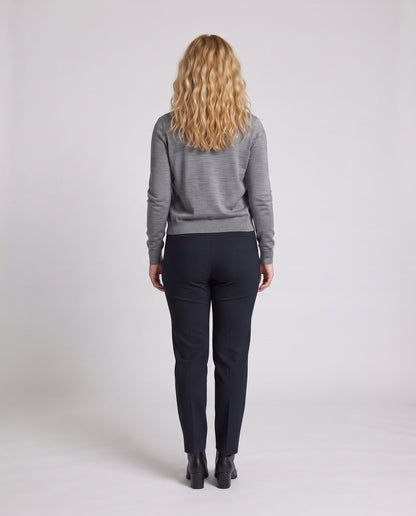 Women's fitted fine knit cardigan with round neck and delicate metal button placket Shop Velvia