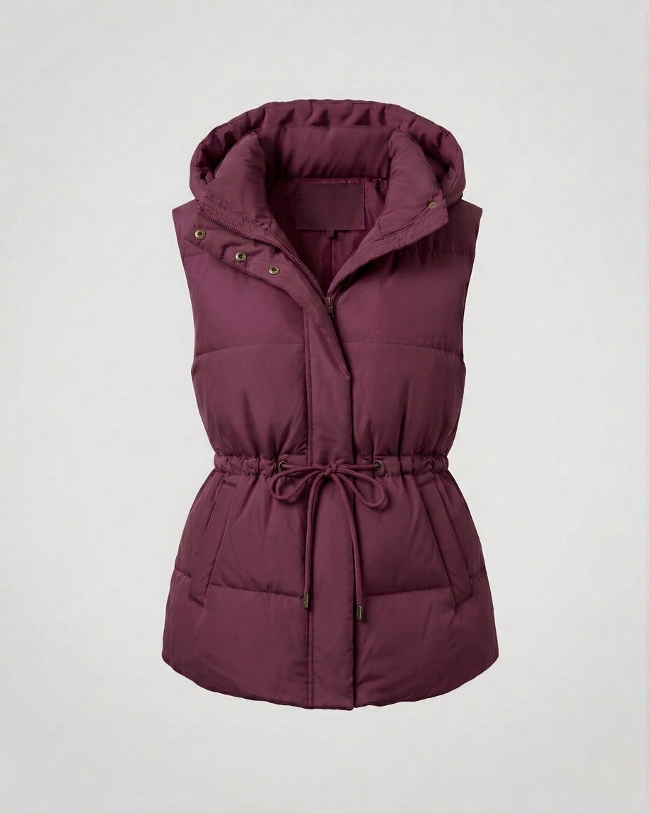 Women's quilted hooded vest with waist drawstring, padded thermal filling, and generous side pockets