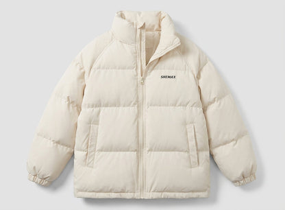 Women's unlined boxy puffer jacket with high stand-up collar, raglan sleeves, and clean logo