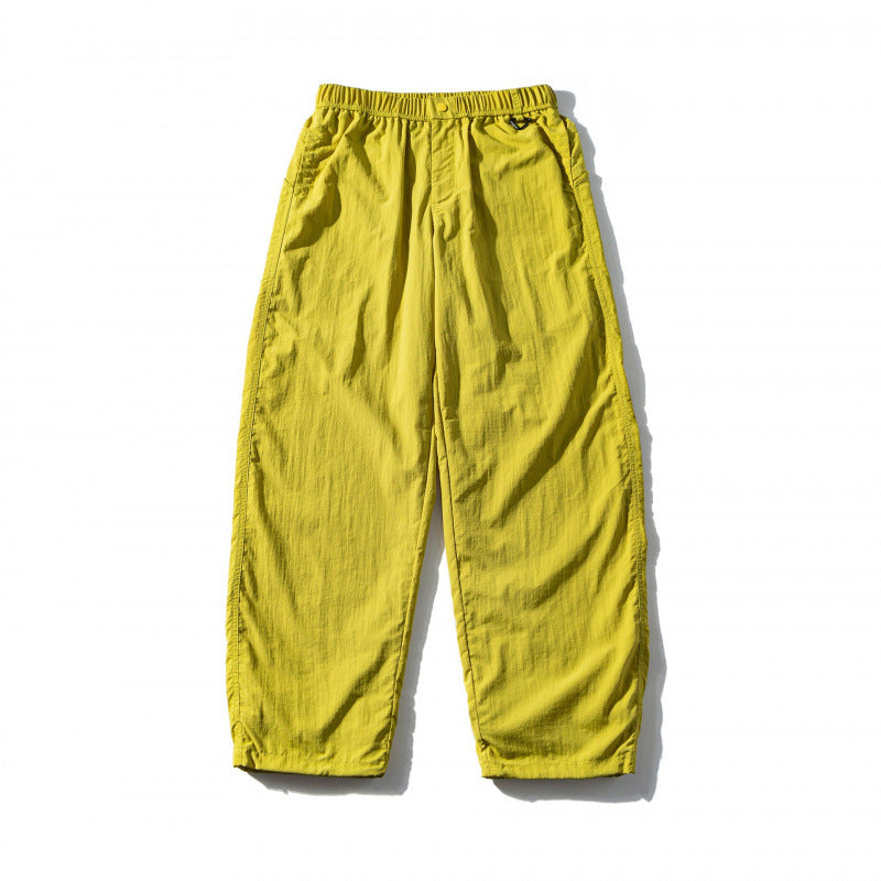 Unisex Loose Crinkle Pants with elastic drawstring waistband, drop-crotch, and side pockets Shop Velvia