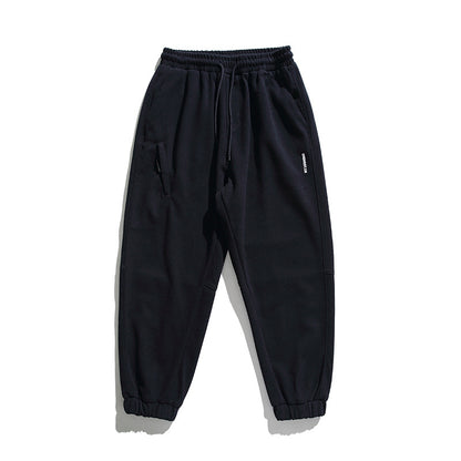 Unisex wide jogging pants in oversized cut with elastic waistband, knee panel and ribbed cuffs Shop Velvia