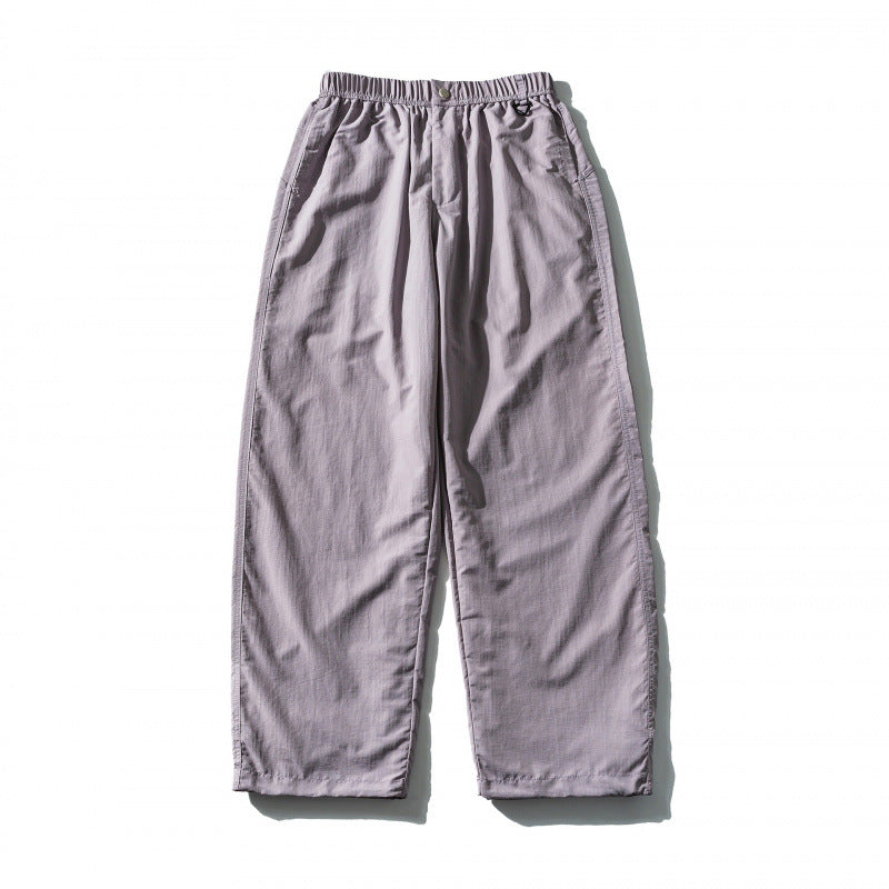 Unisex Loose Crinkle Pants with elastic drawstring waistband, drop-crotch, and side pockets Shop Velvia