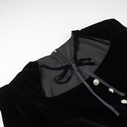 Women’s velvet dress with fitted bodice, puff sleeves, and layered ruffle skirt Shop Velvia