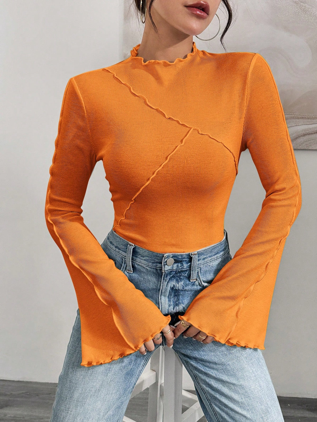 Ladies Fitted Ribbed Long Sleeve Shirt with Stand-up Collar and Ruffled Hem Shop Velvia