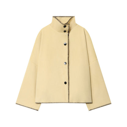 Women's short cape coat with stand collar, contrasting decorative stitch edge, and oversized sleeves Shop Velvia