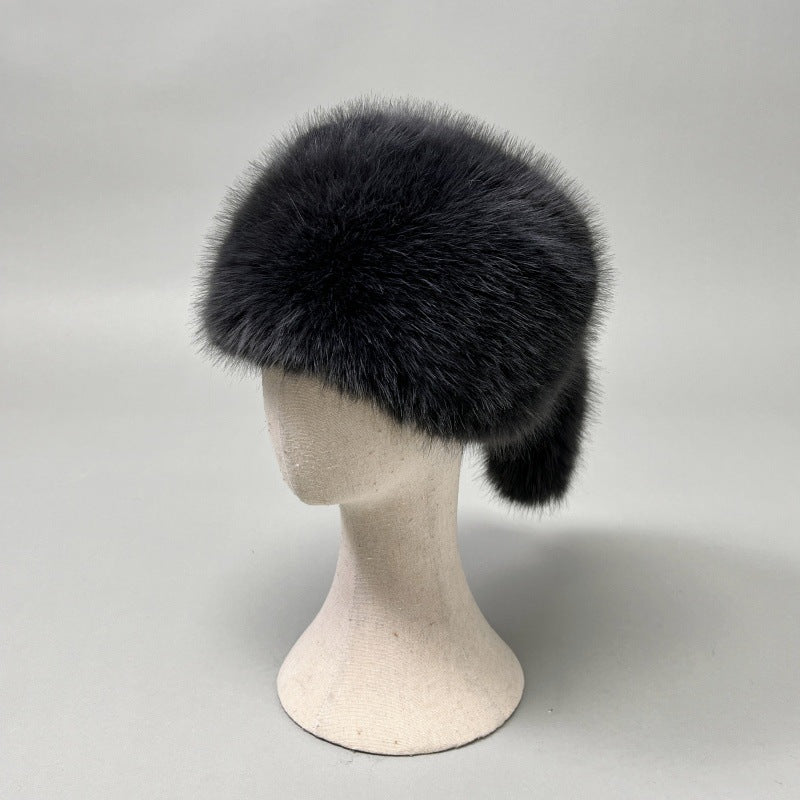 Women’s plush faux fur trapper hat with earflaps and decorative tail Shop Velvia