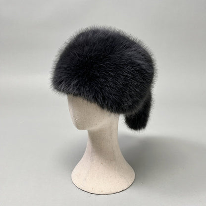 Women’s plush faux fur trapper hat with earflaps and decorative tail Shop Velvia