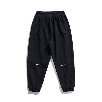 Unisex wide jogging pants in oversized cut with elastic waistband, knee panel and ribbed cuffs Shop Velvia