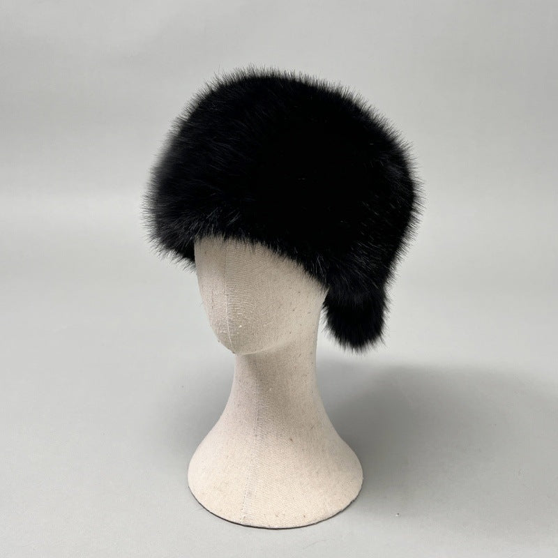 Women’s plush faux fur trapper hat with earflaps and decorative tail Shop Velvia