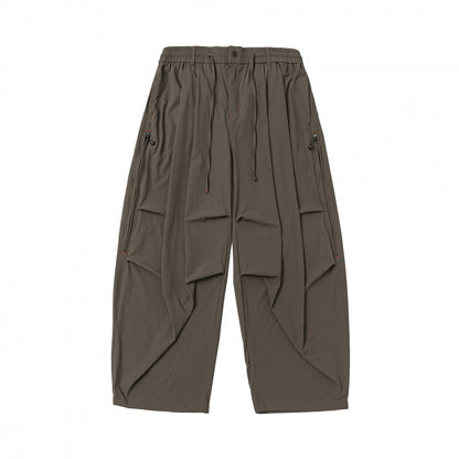 Unisex Loose-fitting technical cargo pants with elastic waistband, drawstring, and zip pockets Shop Velvia