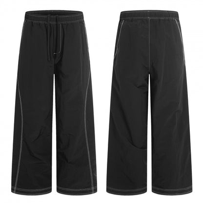 Women's wide pants with elastic waistband, drawstring and contrasting decorative seams Shop Velvia