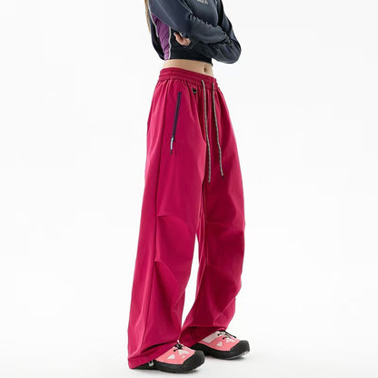 Loose trekking pants with water-repellent quick-drying coating, elastic drawstring waist, and zippered pockets Shop Velvia
