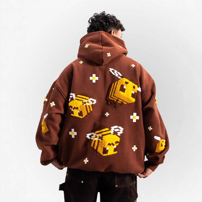 Unisex hoodie with knitted pixel bee design and attached kangaroo pocket Shop Velvia