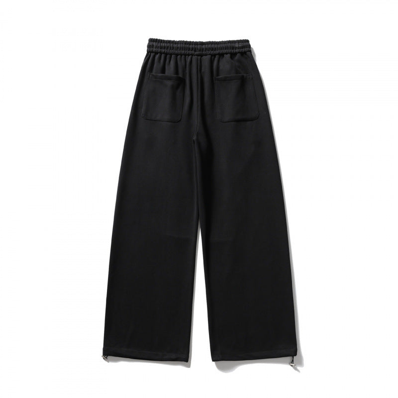 Unisex Wide Sweatpants with drawstring waistband, cord drawstring, and adjustable leg straps Shop Velvia