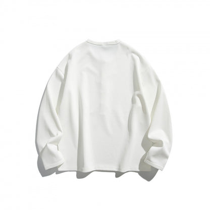 Unisex waffle texture Henley shirt with button placket and oversized fit Shop Velvia