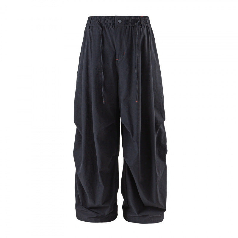 Unisex Loose-fitting technical cargo pants with elastic waistband, drawstring, and zip pockets Shop Velvia