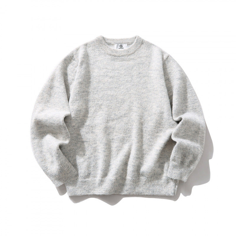 Unisex Oversize fine knit sweater with round neckline, ribbed cuffs, and mottled wool blend Shop Velvia
