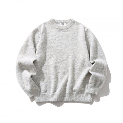Unisex Oversize fine knit sweater with round neckline, ribbed cuffs, and mottled wool blend Shop Velvia