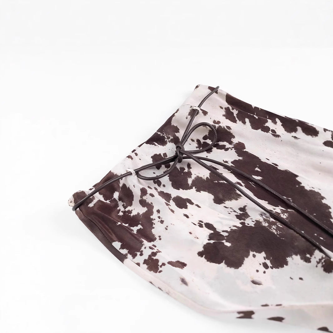 Women's loosely cut shirt blouse with cow spot print and concealed button placket Shop Velvia