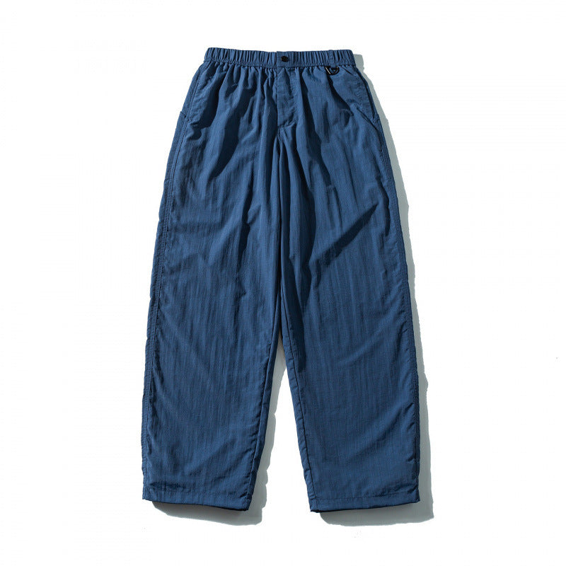 Unisex Loose Crinkle Pants with elastic drawstring waistband, drop-crotch, and side pockets Shop Velvia