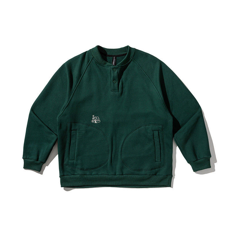 Unisex Oversize Henley Sweatshirt with raglan sleeves, button placket, and distinctive round pockets Shop Velvia
