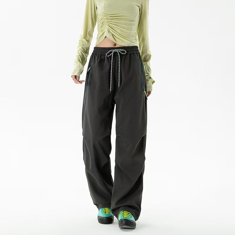 Loose trekking pants with water-repellent quick-drying coating, elastic drawstring waist, and zippered pockets Shop Velvia