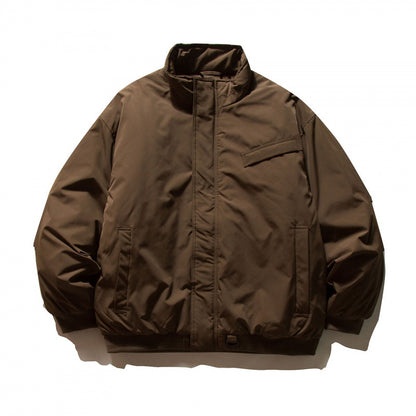 Unisex Boxy-padded transition jacket with high stand-up collar and utility pockets Shop Velvia