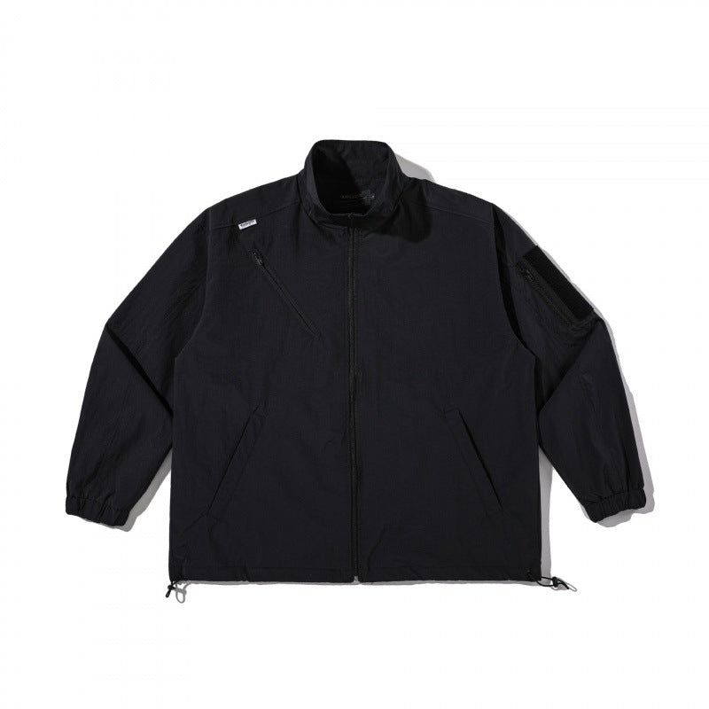 Unisex Lightweight Technical-Utility Jacket with Stand Collar, Zipper Pockets and Drawstring Hem Shop Velvia