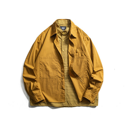 Men's layered look overshirt with patch front pockets, loose fit and checked underlay Shop Velvia