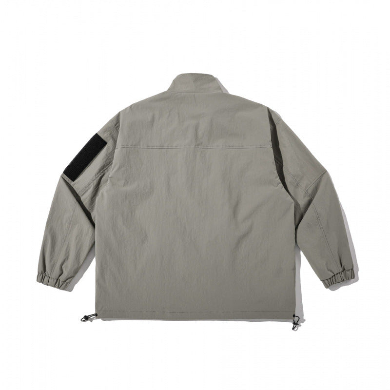 Unisex Lightweight Technical-Utility Jacket with Stand Collar, Zipper Pockets and Drawstring Hem Shop Velvia