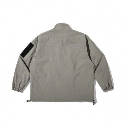 Unisex Lightweight Technical-Utility Jacket with Stand Collar, Zipper Pockets and Drawstring Hem Shop Velvia