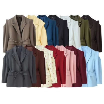Women's blazer with shoulder cutouts, belted waist and single button closure Shop Velvia