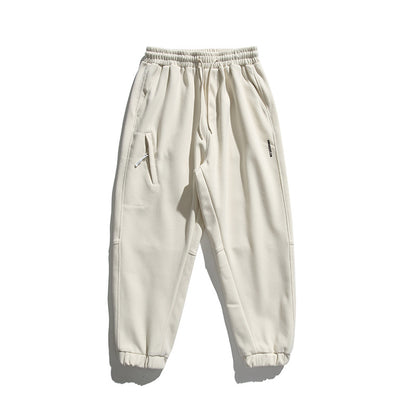 Unisex wide jogging pants in oversized cut with elastic waistband, knee panel and ribbed cuffs Shop Velvia