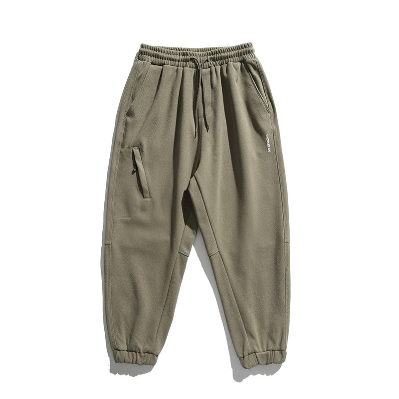 Unisex wide jogging pants in oversized cut with elastic waistband, knee panel and ribbed cuffs Shop Velvia