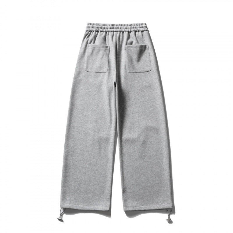 Unisex Wide Sweatpants with drawstring waistband, cord drawstring, and adjustable leg straps Shop Velvia