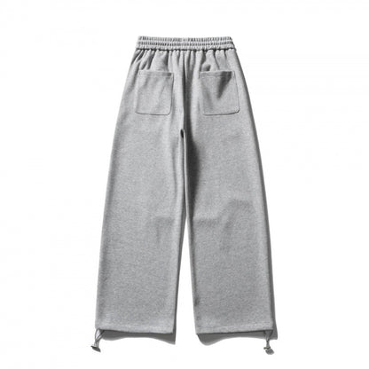 Unisex Wide Sweatpants with drawstring waistband, cord drawstring, and adjustable leg straps Shop Velvia