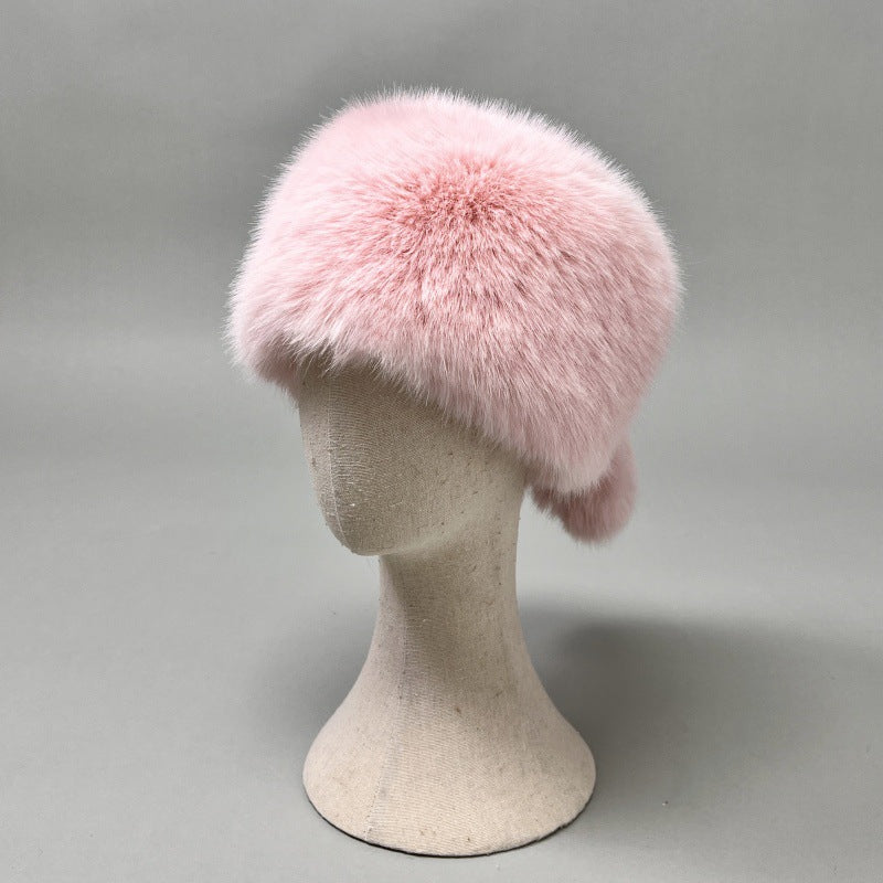 Women’s plush faux fur trapper hat with earflaps and decorative tail Shop Velvia
