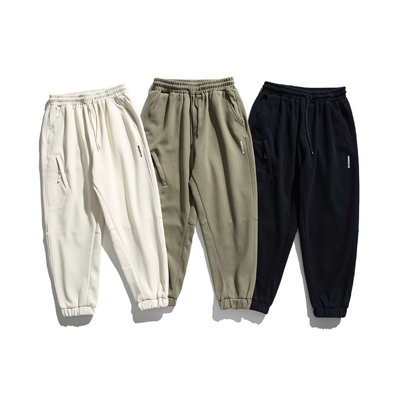 Unisex wide jogging pants in oversized cut with elastic waistband, knee panel and ribbed cuffs Shop Velvia