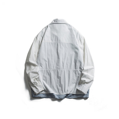 Men's layered look overshirt with patch front pockets, loose fit and checked underlay Shop Velvia