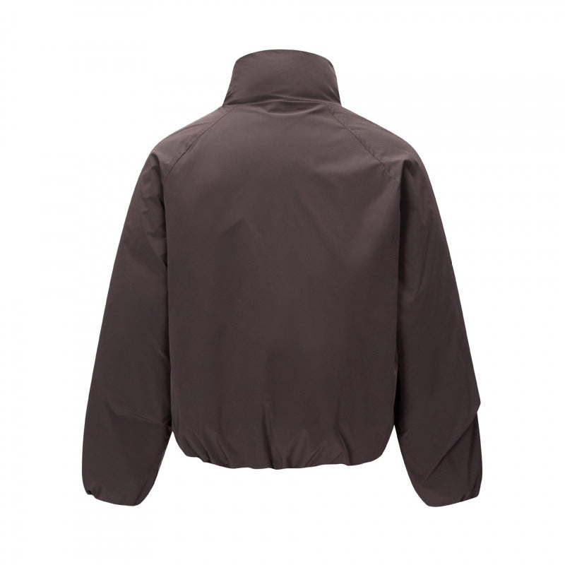 Unisex Short cut lightweight windbreaker in boxy cut with high stand-up collar and elastic hem Shop Velvia