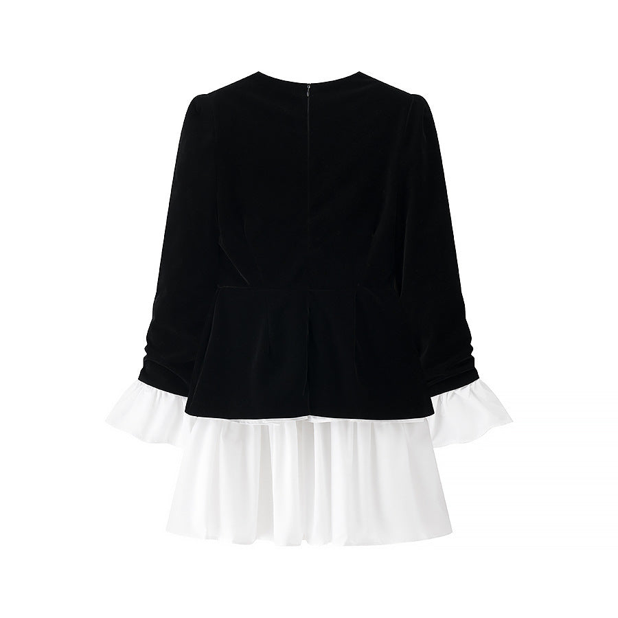 Women’s velvet dress with fitted bodice, puff sleeves, and layered ruffle skirt Shop Velvia